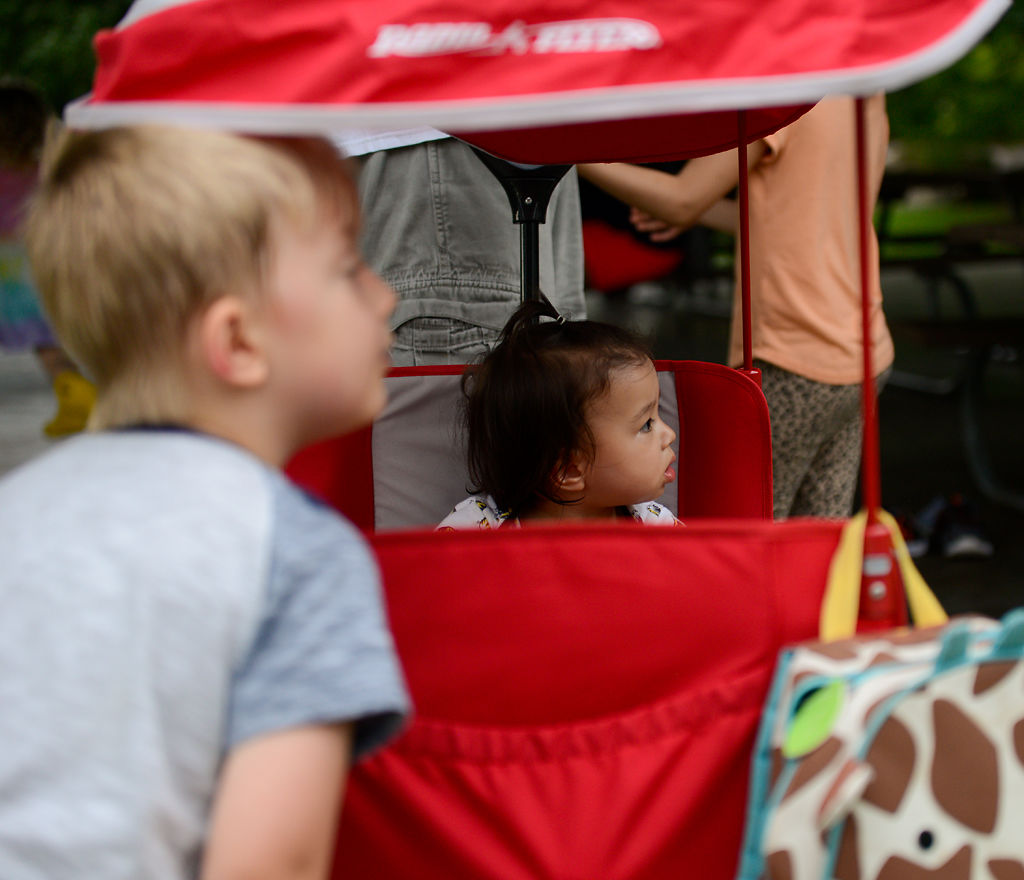 Mia Francisco, 1, looks out from her Radio Flyer at the Family Fun Fest